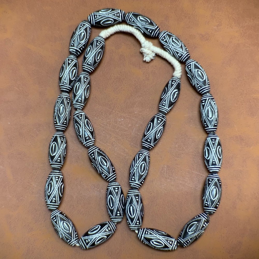 Black-and-white carved beaded necklace
